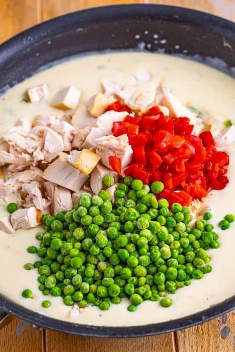 Diced chicken, peas, and pimentos on top of a thick cream sauce.