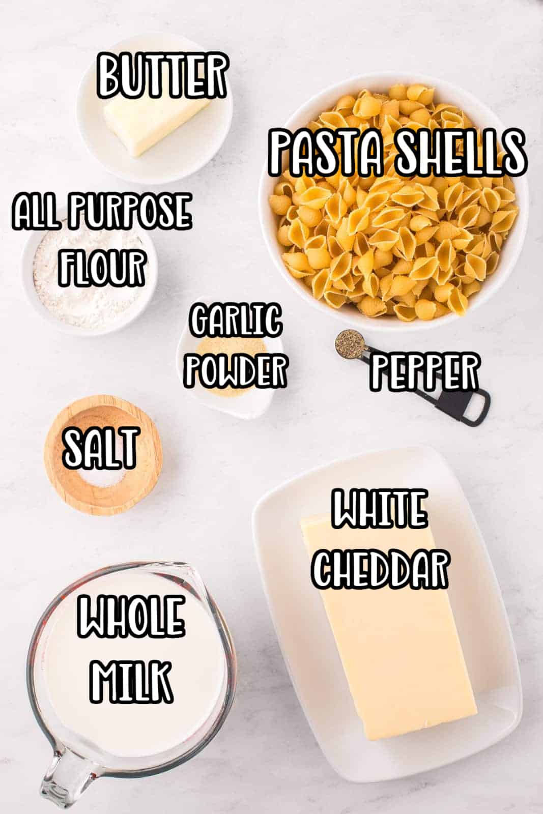 pasta shells, white cheddar cheese, butter, all purpose flour, garlic powder, salt, pepper, and milk.