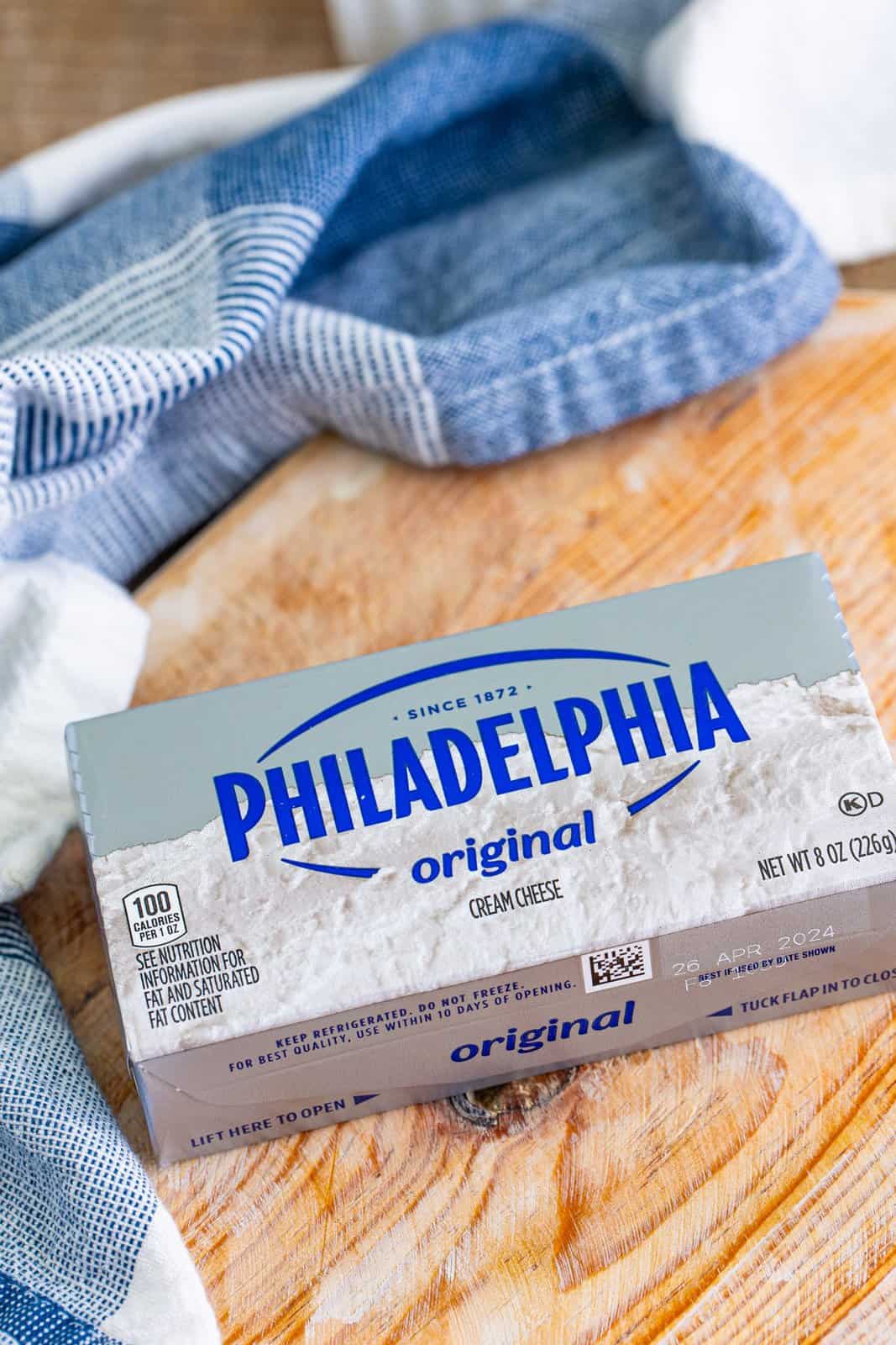 A brick of Philadelphia Cream Cheese still in the wrapper and box. 
