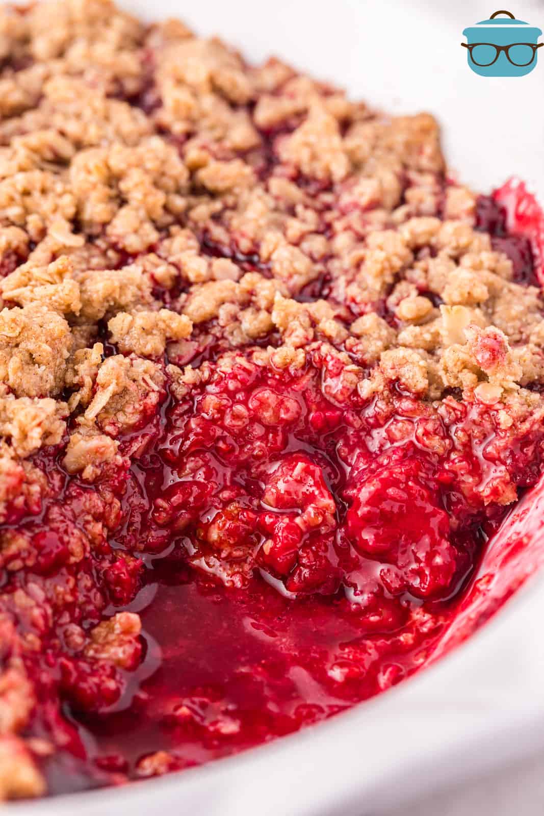 Looking down on a Raspberry Crumble with a scoop removed.