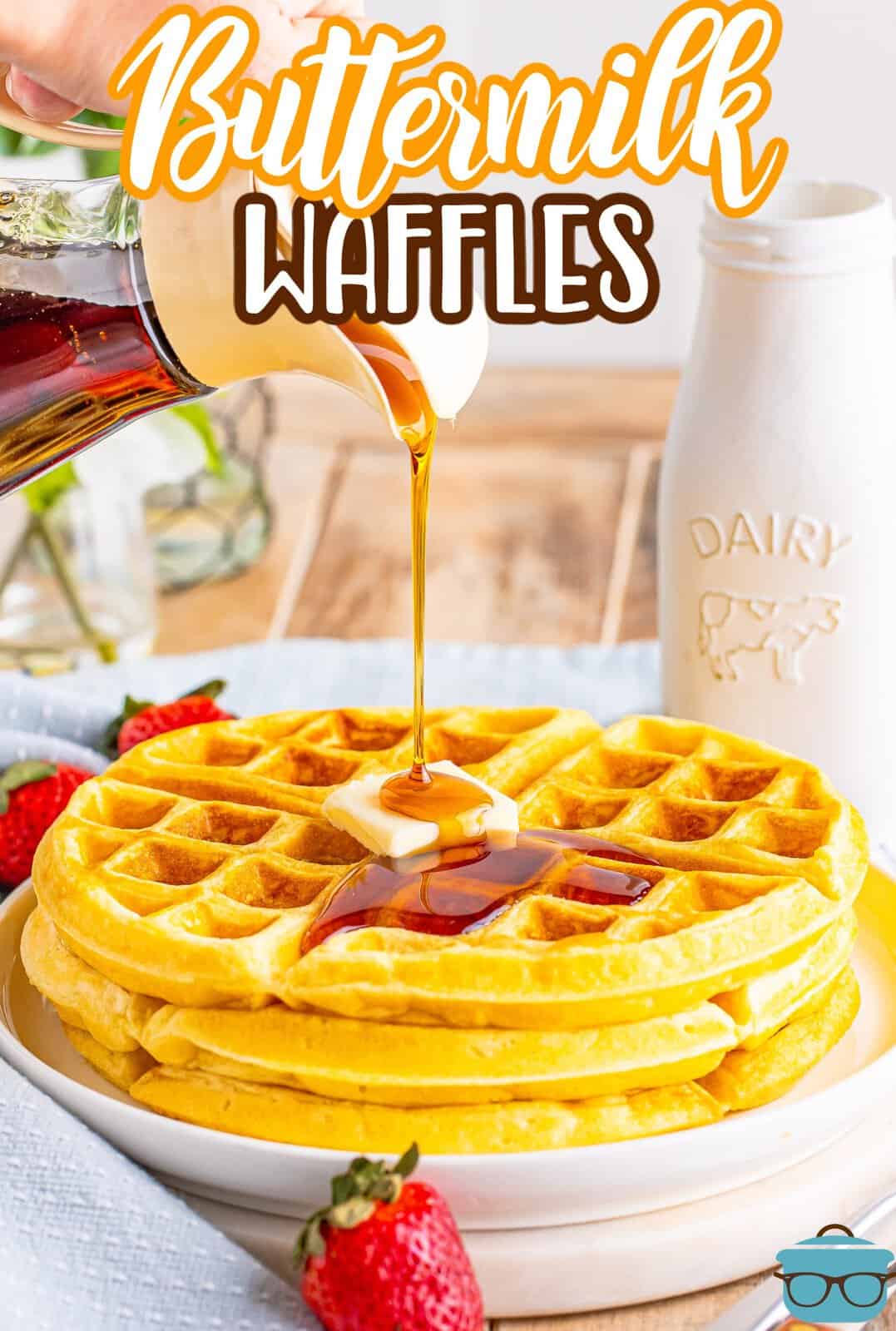 Syrup being poured on a small stack of buttermilk waffles.