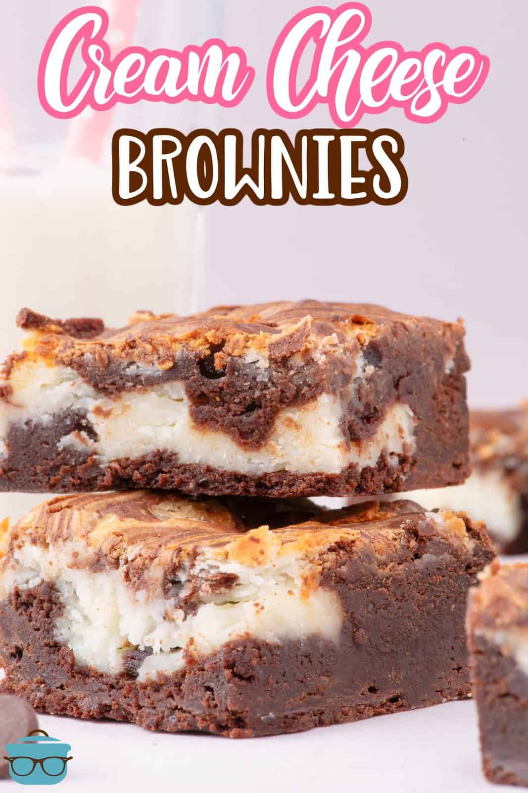 Two Fudgy Cream Cheese Brownies in a stack.