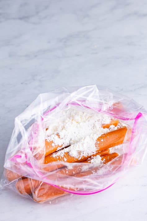 Hot dogs in a ziptop bag with flour.