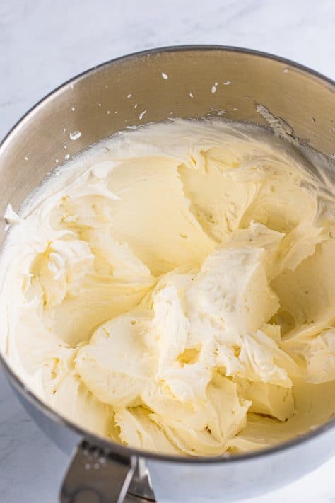 fluffy buttercream frosting in a mixing bowl.
