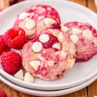 Three Raspberry White Chocolate Cookies on a serving plate.