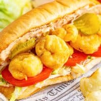 Close up looking at a Shrimp Po Boy sub with fried shrimp.