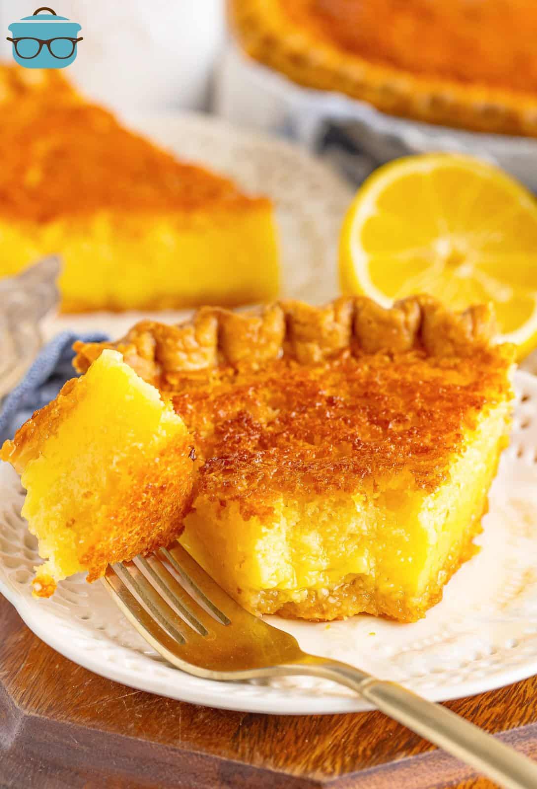 A slice of Buttermilk Pie with a fork holding a bite. 