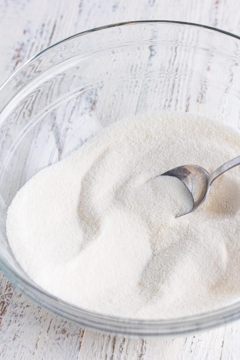 Sugar and flour in a mixing bowl.