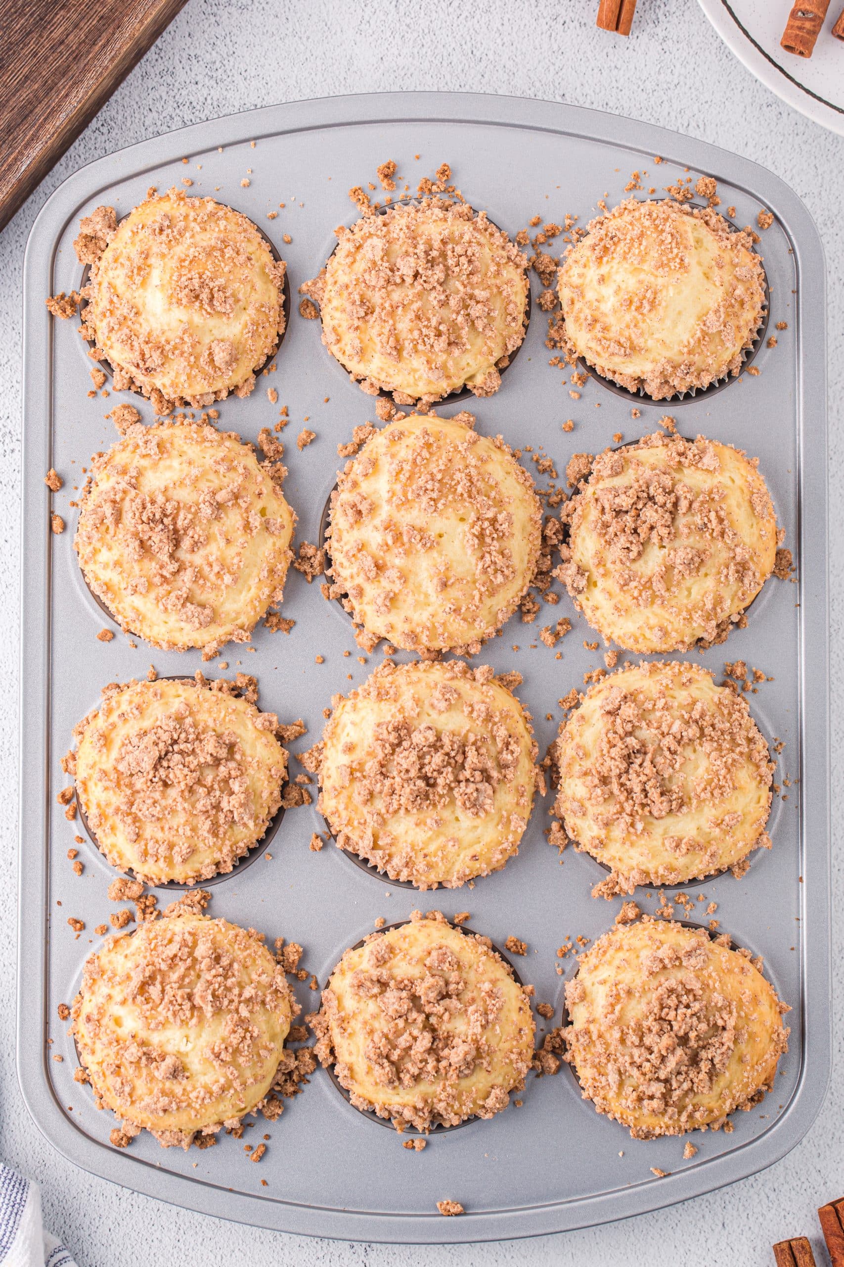 Fresh baked Cinnamon Streusel Cake Mix Muffins in the pan still.