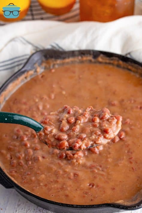 A spoon holding a scoop of Red Beans.
