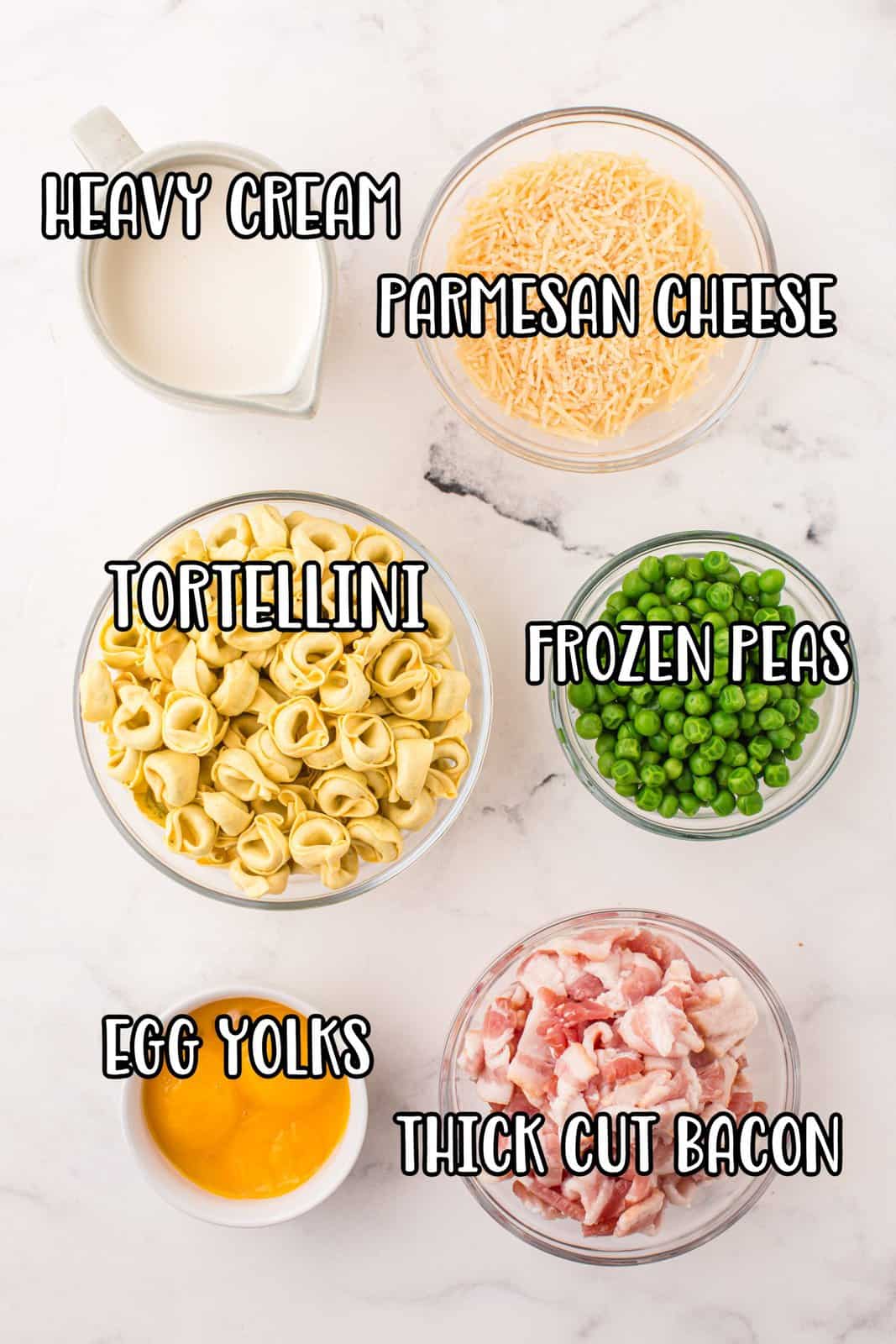 Tortellini, frozen peas, egg yolks, bacon, parmesan cheese, and heavy cream.