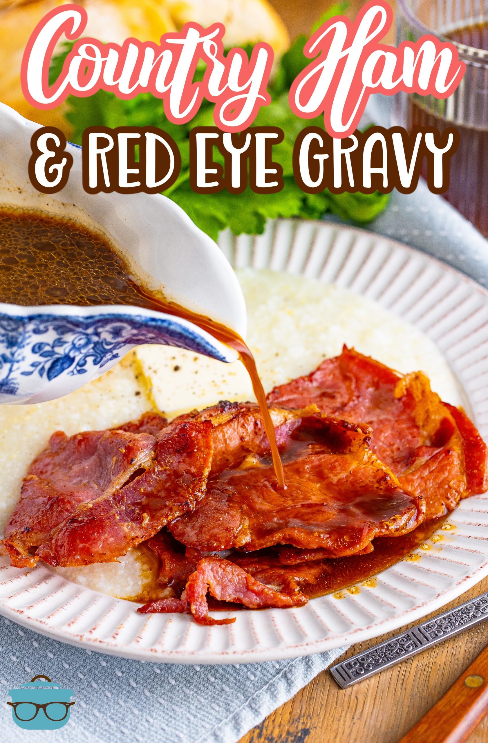 Gravy being poured on a serving of Country Ham and Red Eye Gravy on a plate.