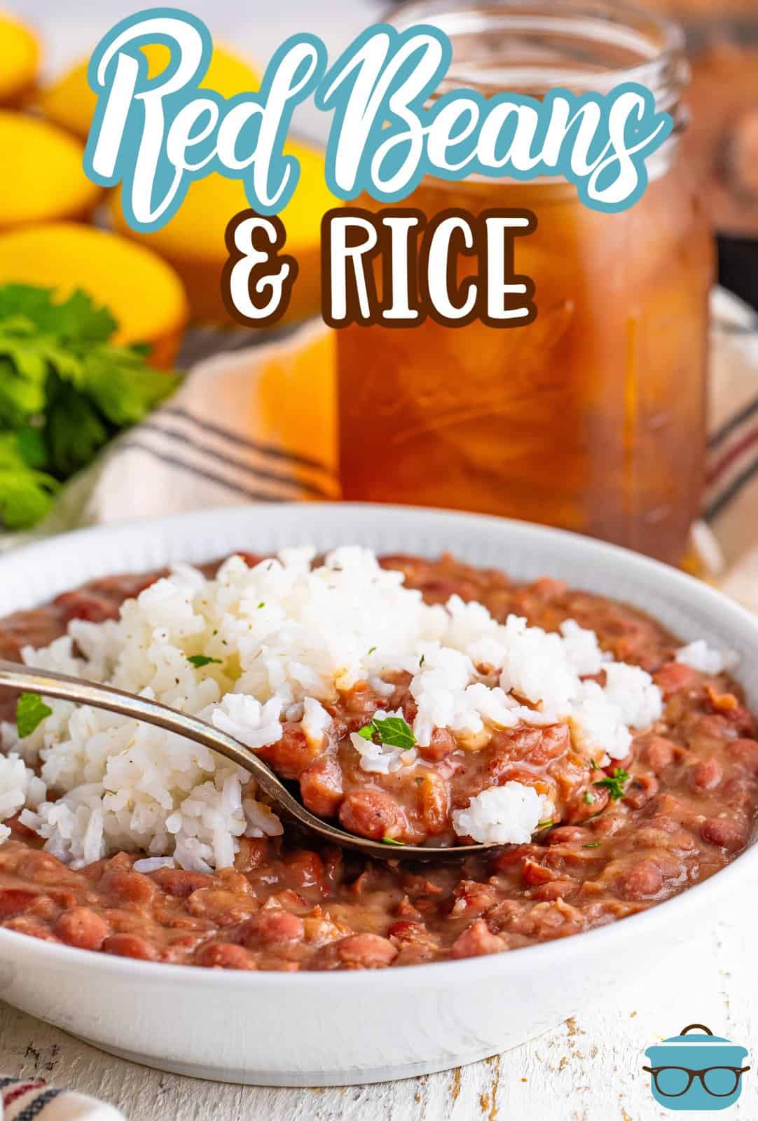 A spoon in a bowl full of Red Beans and Rice.
