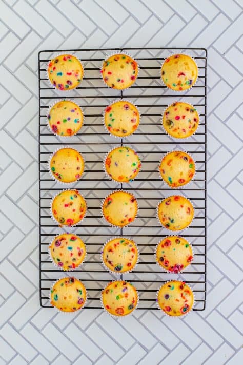 Funfetti Cupcakes cooling on a wire rack.