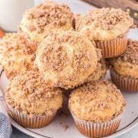 A plate with a pile of Cinnamon Streusel Cake Mix Muffins.