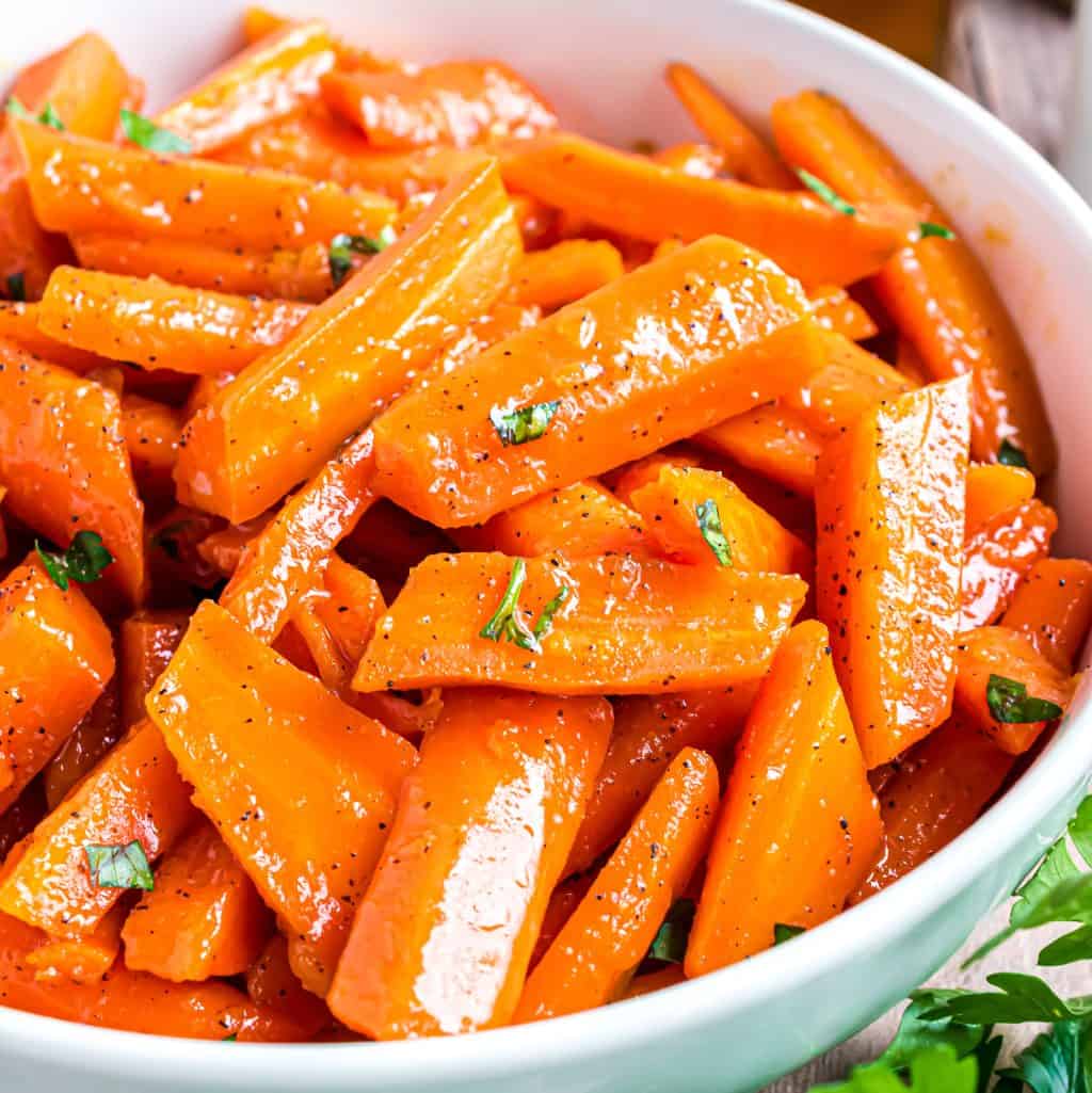 Close up looking at a bowl of Honey Glazed Carrots.