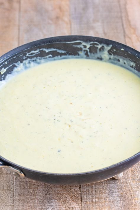 A thick cream sauce in a skillet.