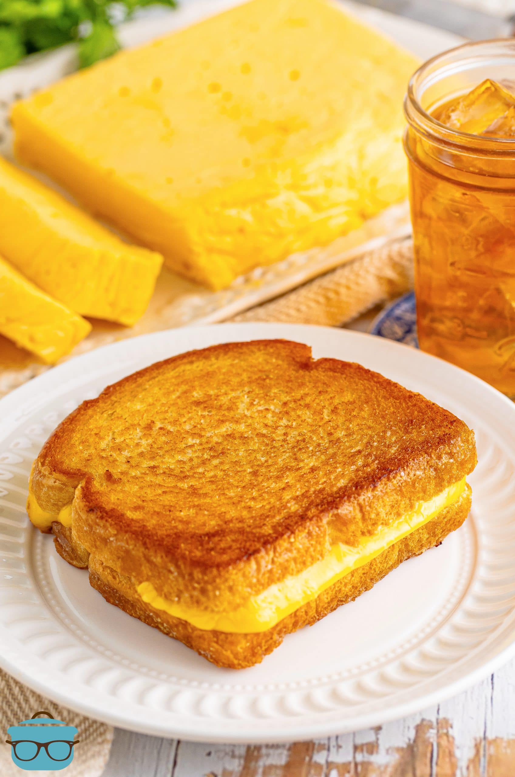 A grilled cheese on a plate with Homemade Velvetta cheese.