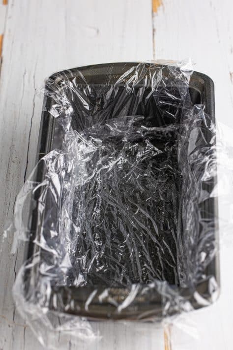 A plastic wrap lined loaf pan.