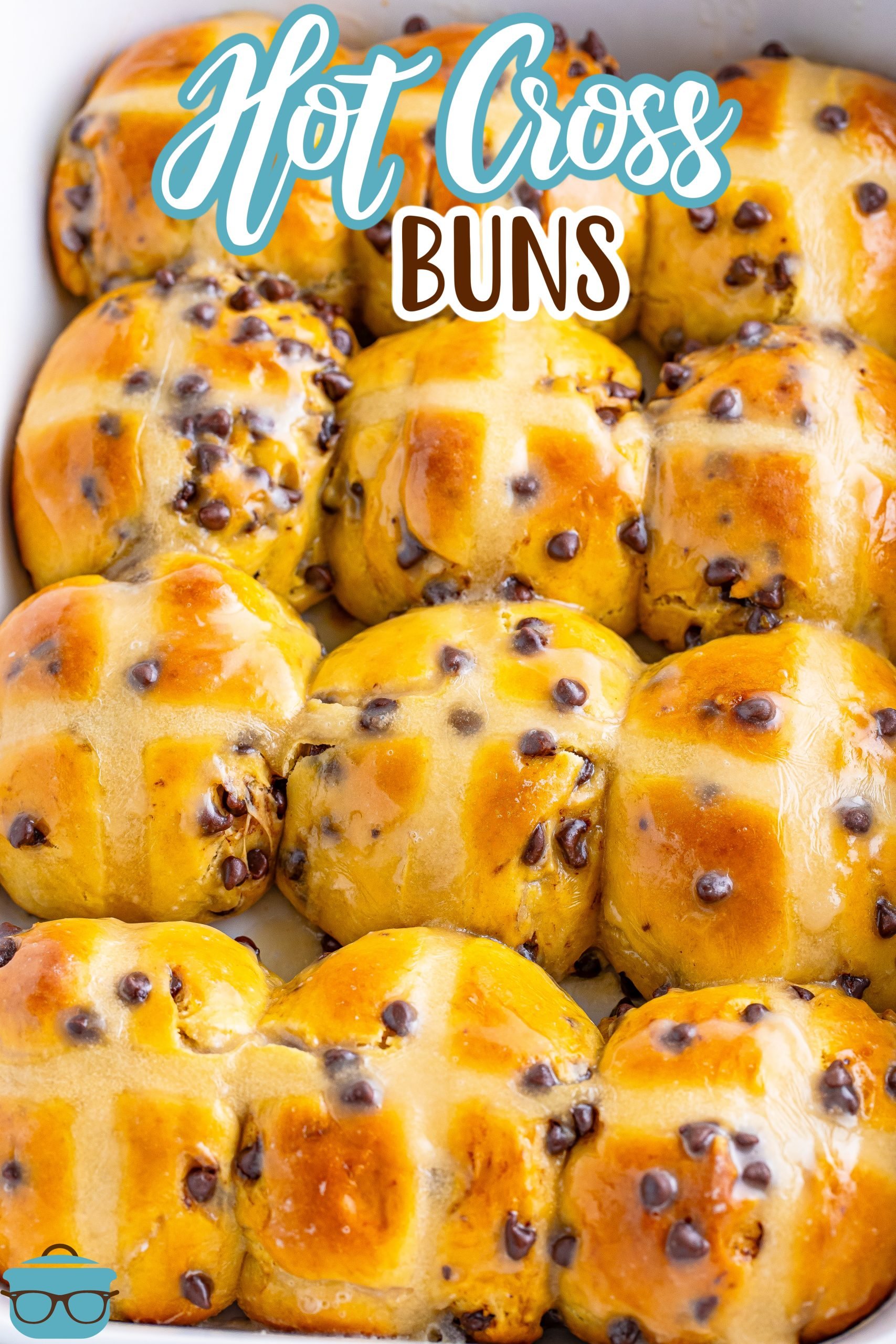 A batch of Hot Cross Buns in a baking dish.