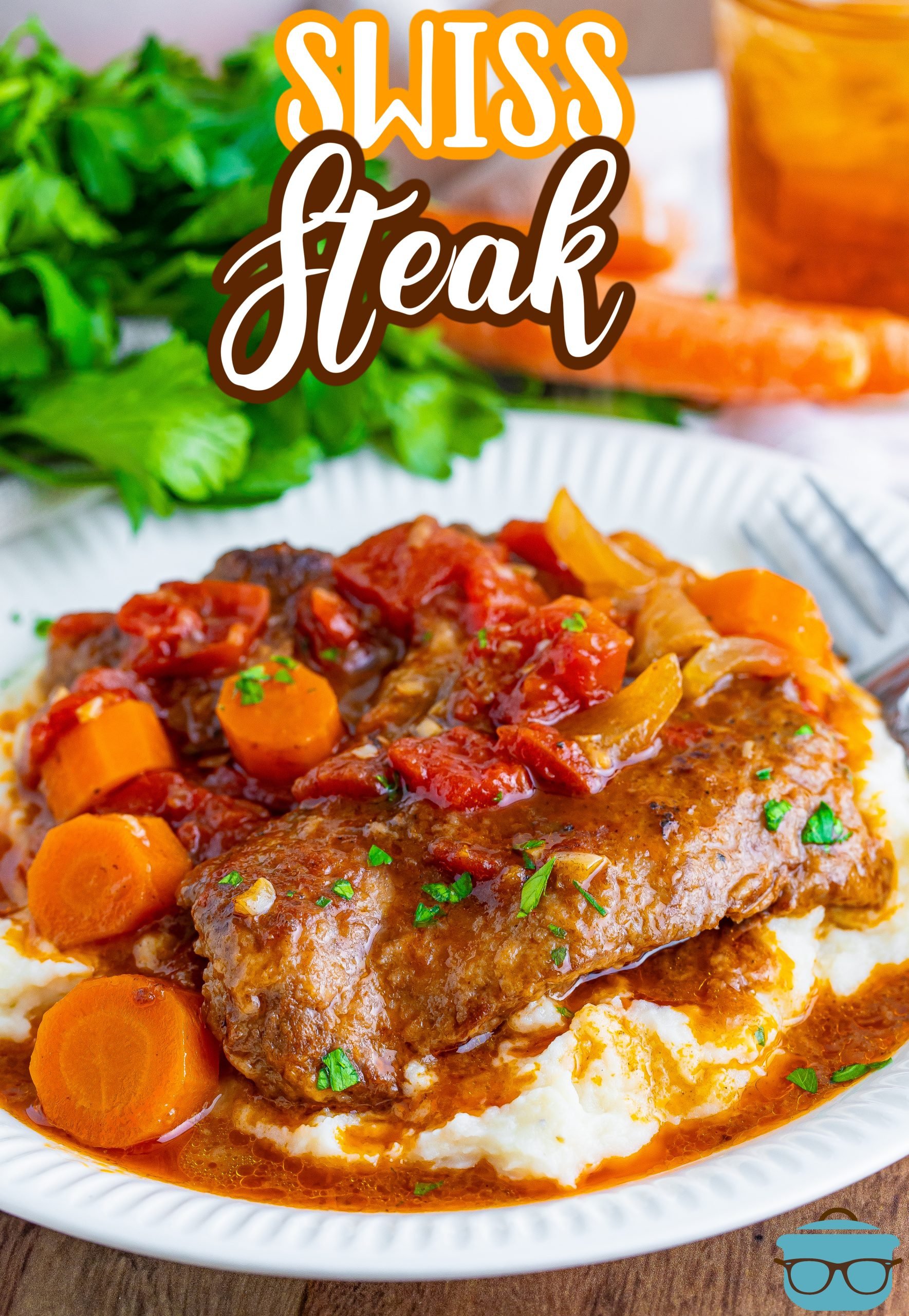 A complete Swiss Steak dinner meal on a plate.