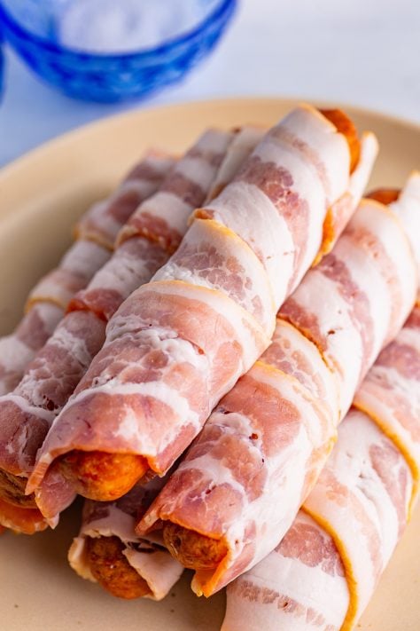 Bacon wrapped around beer brats.
