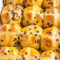 Looking down closely at a bunch of Hot Cross Buns.