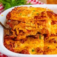 A serving utensil getting a serving of Lasagna for Two.