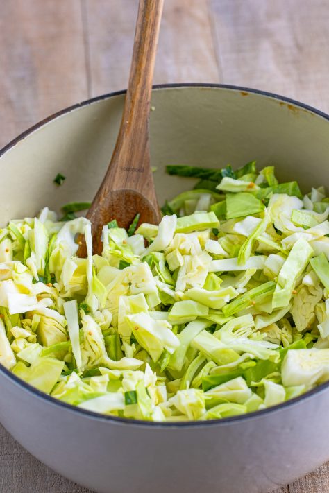 Sliced cabbage in a dutch oven.
