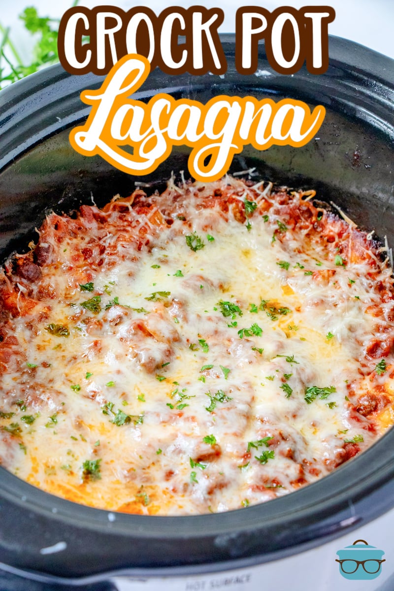 fully baked lasagna with melted cheese on top in the slow cooker. 