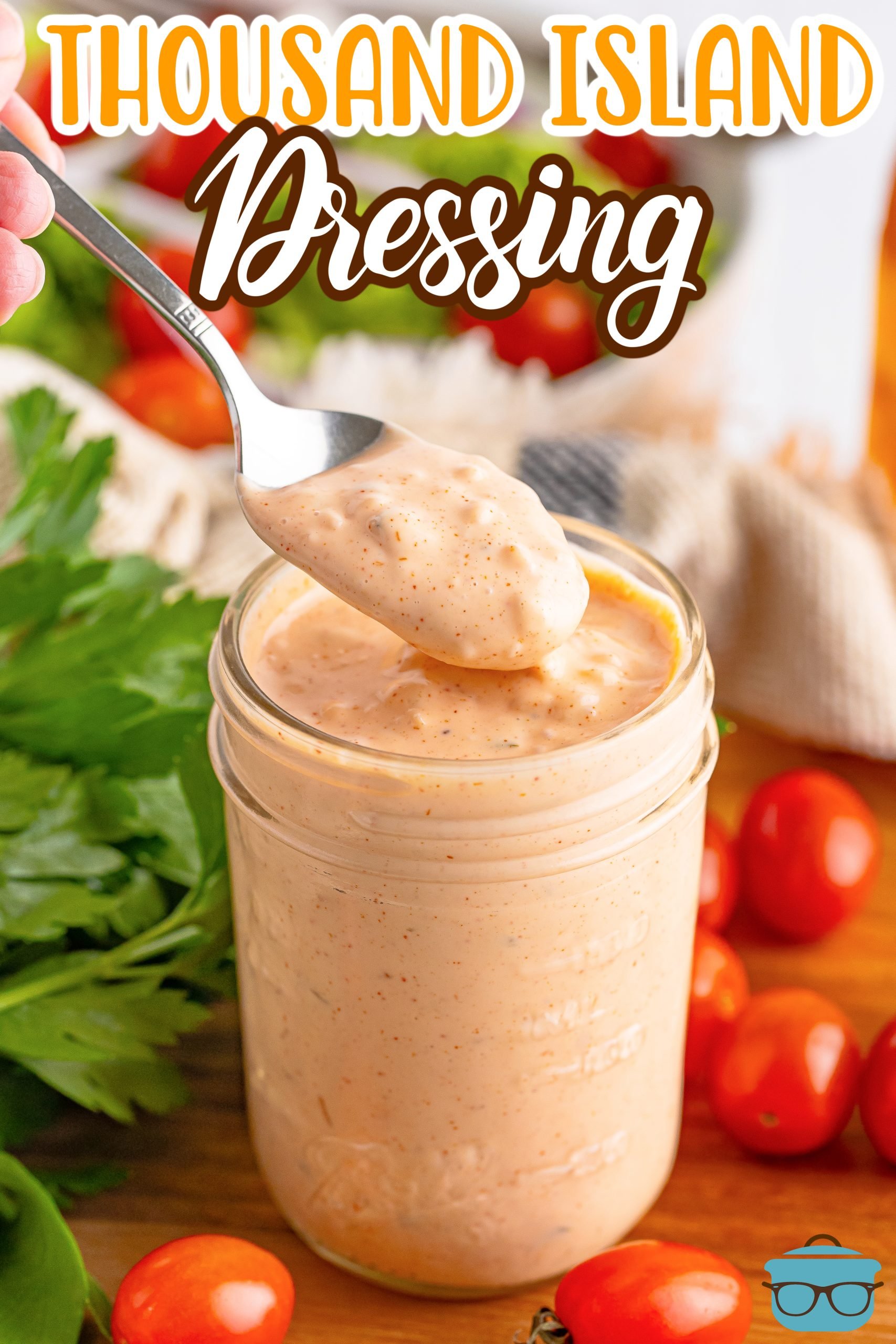 A jar of Thousand Island Dressing with a spoon removing some.