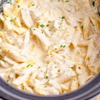 A crock pot insert filled with Penne Chicken Alfredo for Two.