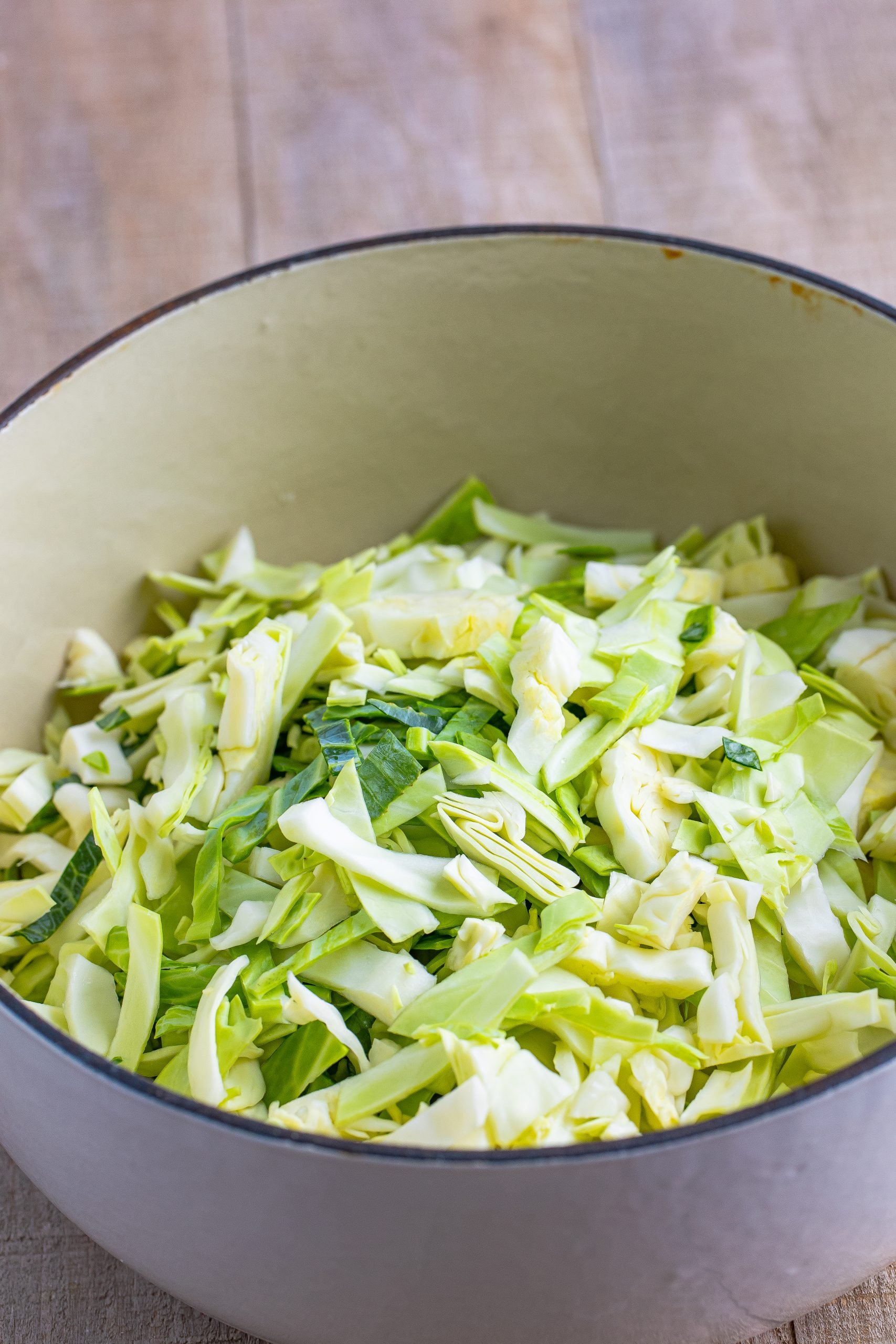 sliced cabbage in a dutch oven pot.