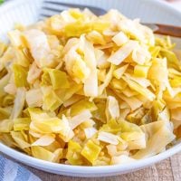a white plate topped with homemade sauerkraut.