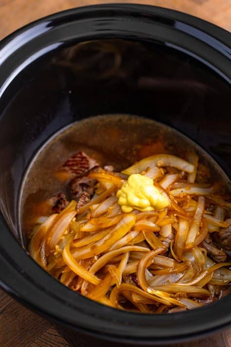 dijon mustard, Worcestershire sauce and beef broth added to the slow cooker.