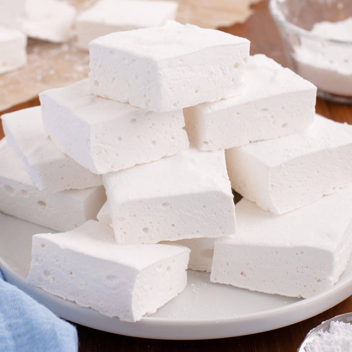 A plate with a pile of Homemade Marshmallows.