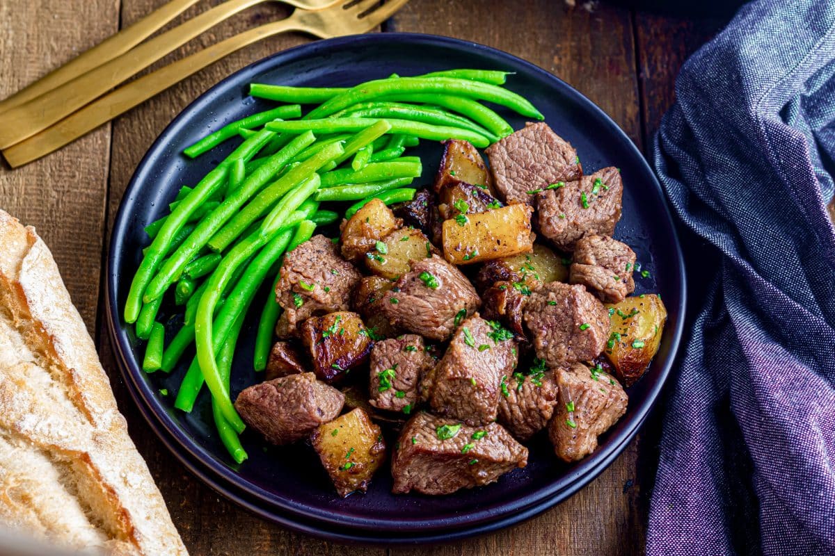 Garlic Butter Steak Bites and Potatoes - The Country Cook