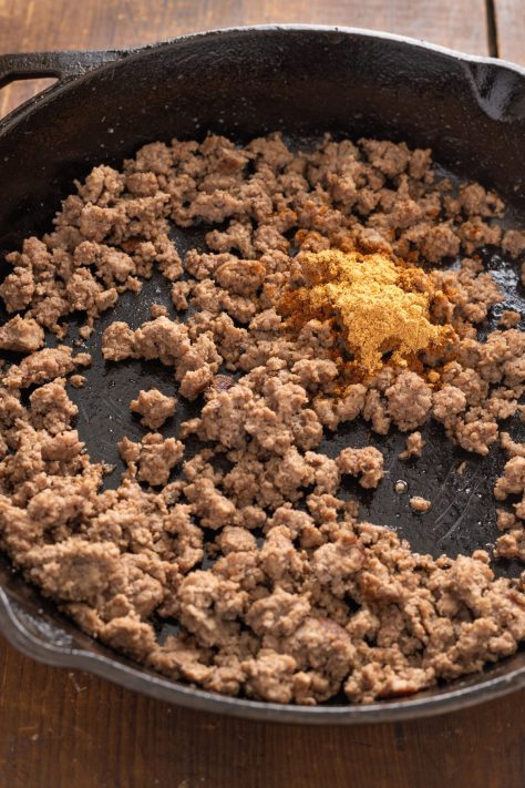 Cooked ground beef with taco seasoning.