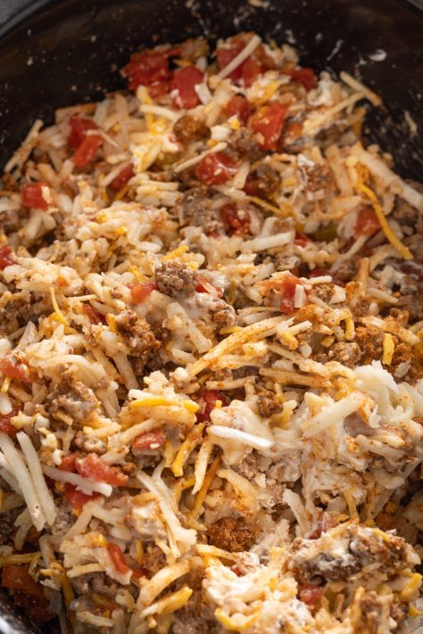 An unbaked Taco Casserole in a Crockpot.
