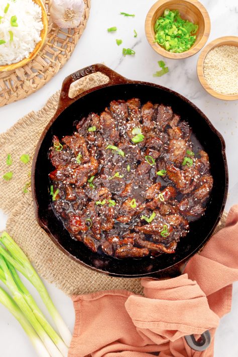 A skillet with Beef Teriyaki.