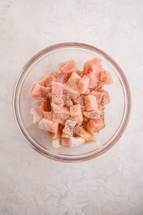 Seasoned chicken in a bowl.