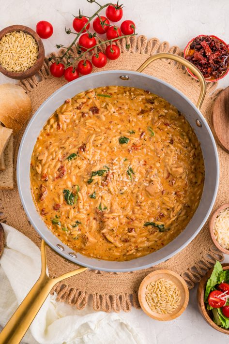 Marry Me Chicken and Orzo in a skillet.