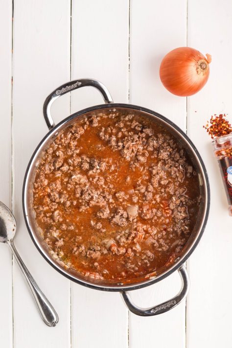 A cheeseburger and rice mixture in a pan.