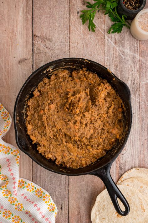 A beef and bean mixture in a skillet.