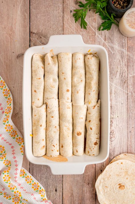 Rolled up tortillas with beef, cheese, and bean mixture.