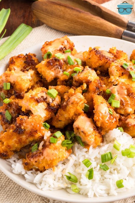 A plate of Bang Bang Chicken on a bed of rice.