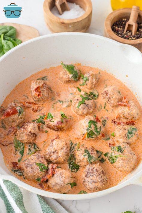 A skillet with Marry Me Chicken Meatballs and sauce.