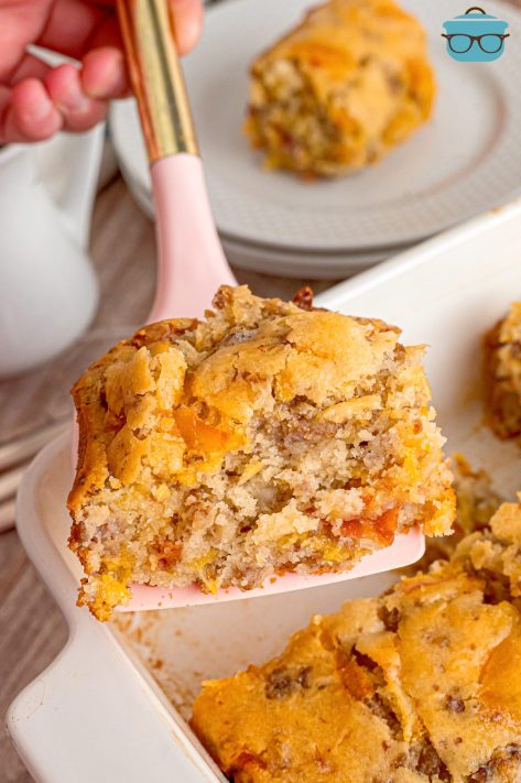 A spatula picking up a scoop of McGriddle Casserole from the baking dish.