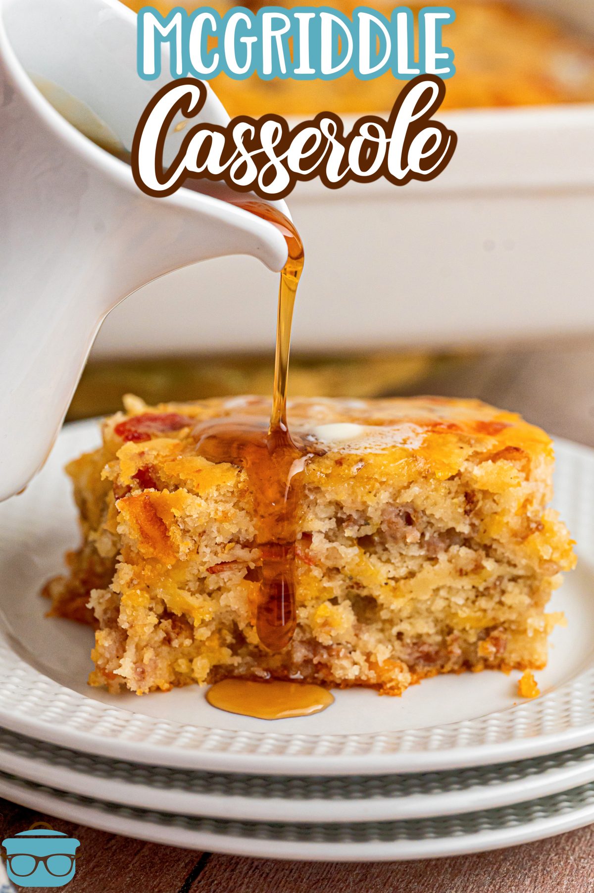 A big serving of McGriddle Casserole and syrup on a plate. 