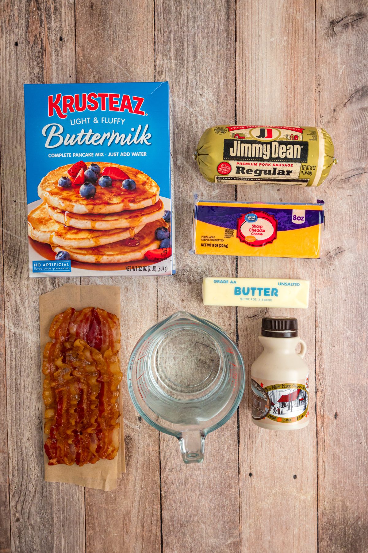 Sausage, bacon, pancake mix, shredded cheese, maple syrup and butter.